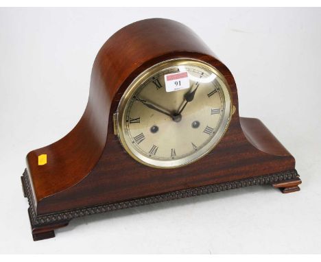 A 1920s mahogany cased mantel clock, having a silvered dial with Roman numerals and eight day movement, w.39cm