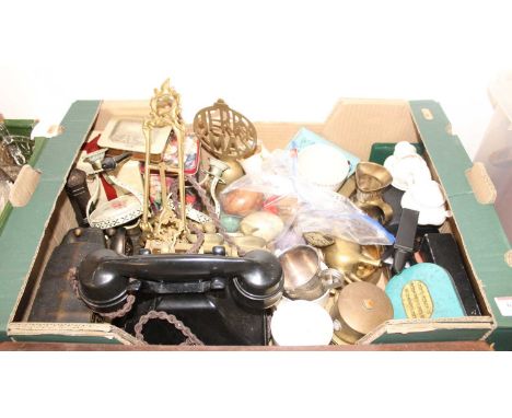 A box of miscellaneous items to include a Rococo style brass table easel, a bakelite telephone, Coronation mugs etc