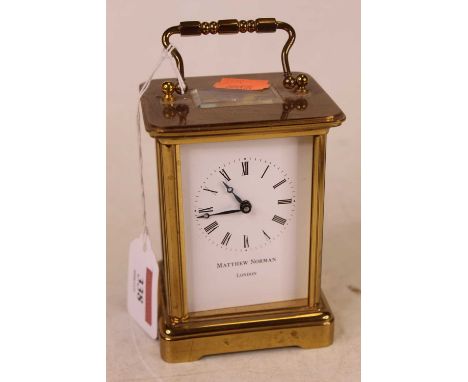 A lacquered brass cased carriage clock, having an enamelled dial with Roman numerals, signed Matthew Norman of LondonConditio