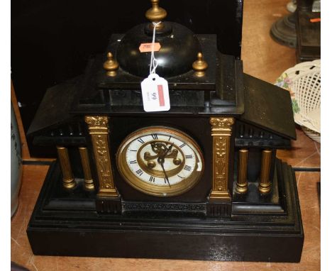 A late Victorian black slate mantel clock, of architectural form, having circular enamelled dial with Roman numerals, visible