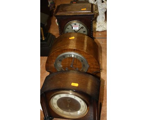 A 1920s oak cased mantel clock, having a silvered dial with Roman numerals, eight day movement striking on a gong, h.29cm; to
