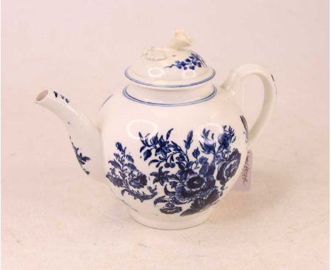 An 18th century Worcester blue and white teapot, of bullet shape, underglaze painted in the Three Flowers pattern, having cre