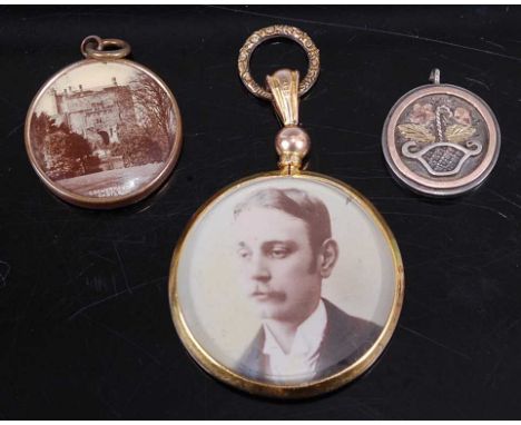 A George V 9ct gold open pendant, dia.30mm; together with a Pinchbeck mounted example; and a silver and yellow metal Masonic(