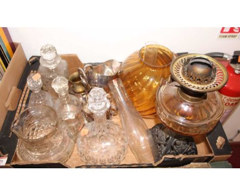 A box of various cut and pressed glass and metal wares to include oil lamp with amber glass shade, cut glass decanters etc 