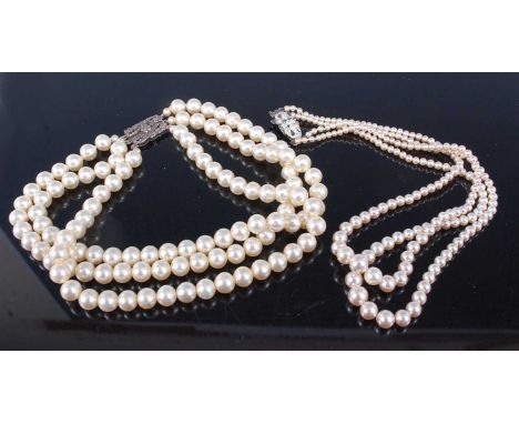 A 1950s Rosita faux pearl double string necklace, together with one other faux pearl necklace and some loose amber stones (3)