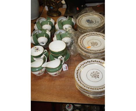 A Royal Worcester twelve-place setting part tea service, in the Miranda pattern; together with a Royal Worcester part dinner 