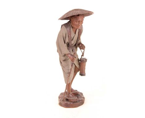 A carved and moulded softwood figure of a gentleman, in standing pose wearing wicker hat, with lantern in one hand and stick 