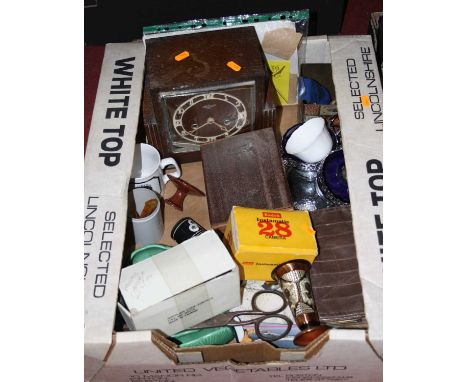 A box of miscellaneous items, to include a boxed Kodak Instamatic 28 camera, an oak cased mantel clock, leather purse, coins 