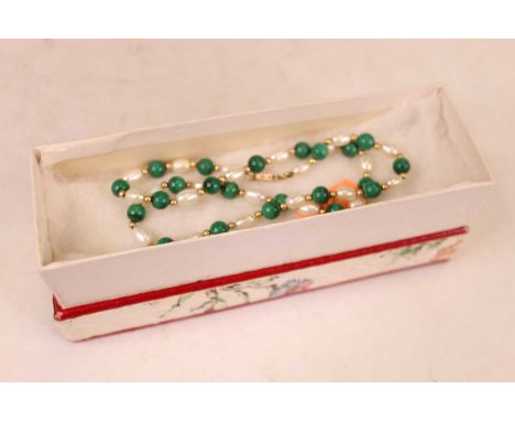A pearl and malachite beaded necklace, with yellow metal clasp, and a red leather clad jewellery box 