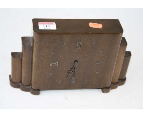 An Art Deco walnut mantel clock, having raised Roman numerals and baton markers, the brass cylinder movement marked Rotherham