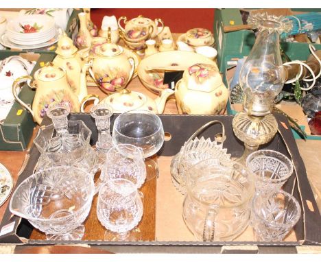 A collection of cut and pressed glassware to include an oil lamp, together with an oak cased canteen of cutlery