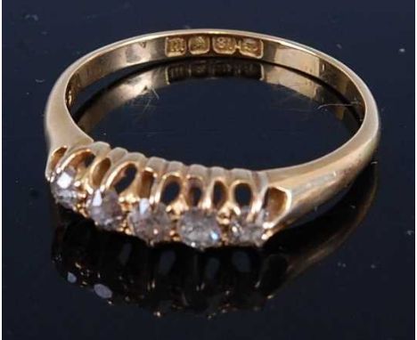 An Edwardian 18ct gold diamond five stone ring, the claw set old round cuts each weighing approx 0.04 carats, 3.3g, size R