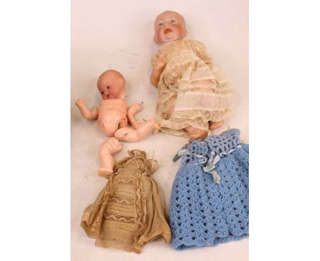 An early 20th century Kammer &amp; Reinhardt bisque head baby doll, having painted eyes and open mouth, with bent limbed comp