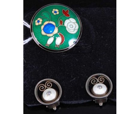 A pair of silver gilt and enamel ear clips, dia.15mm; together with a white metal and enamel flower brooch, stamped 925, dia.