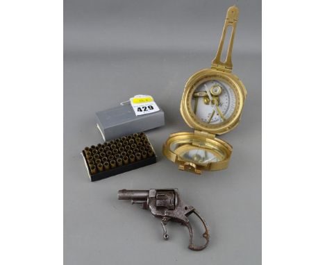 A vintage revolver pocket pistol, a boxed quantity of .22 spent casings &amp; a reproduction brass pocket compass