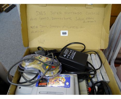 An SNES Super Nintendo console &amp; games E/T
