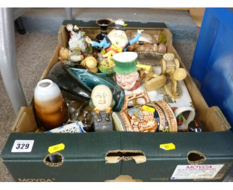A Poole dolphin, a cast iron Humpty Dumpty money box, an assortment of figural ornaments etc