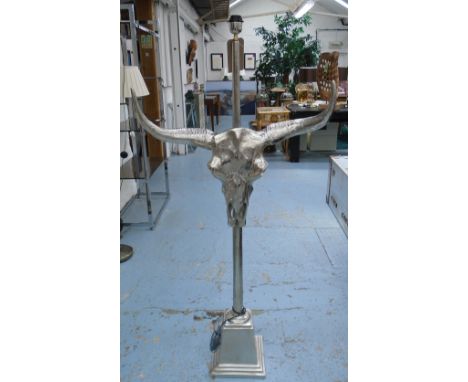 STANDARD LAMP, in chromed metal with a bull's skull, 152cm H.