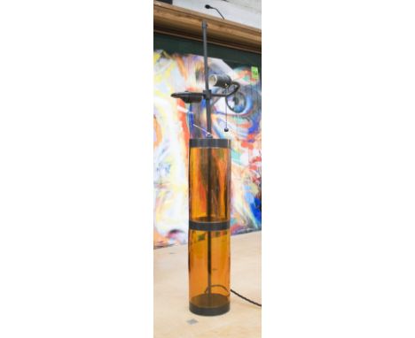 TABLE LAMP, in the form of an amber glass cylinder, 83cm H. (shade lacking)