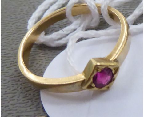 A gold coloured metal ring, set with a ruby (probably 18ct gold)&nbsp; 