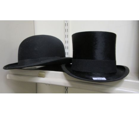 A DM Dunlop black silk top hat&nbsp; 24" circumference; and a bowler hat&nbsp; 