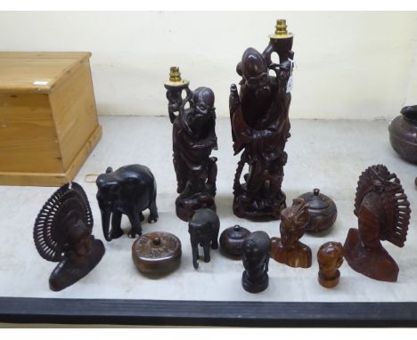 Wooden collectables: to include a mid 20thC Chinese carved fruitwood table lamp, fashioned as an elderly man&nbsp; 