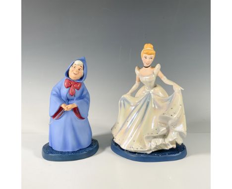 Cinderella, resplendent in her elegant ball gown, gracefully lifts the skirt with her hands, while the Fairy Godmother, adorn