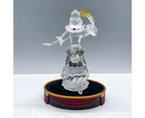 Beautiful clear and frosted figure of a theater character wearing a long dress costume. She is adorned with colorful crystals