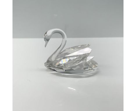 Elegant crystal figure of a swan with its wings tucked behind them from the Beauties of the Lakes theme group. Swarovski back