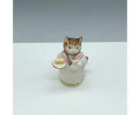 Glossy porcelain figure of a cat holding a pitcher and a stick of butter on a plate. Royal Albert Beatrix Potter backstamp. T