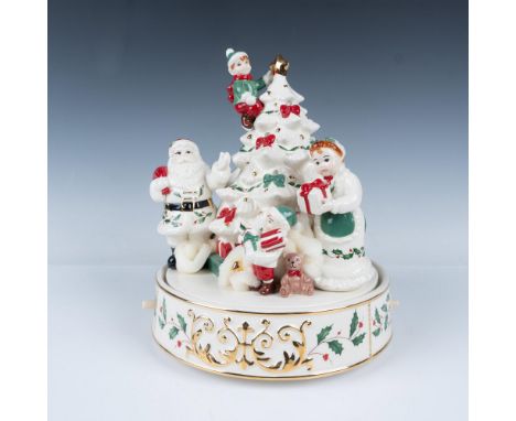 This beautiful porcelain figural music centerpiece features the classic Lenox white hand-painted with red, green and gold emb