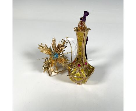 Handcrafted pair of ornaments featuring the Imperial Kildare Drop, adorned with shining ruby gems that complement an intricat