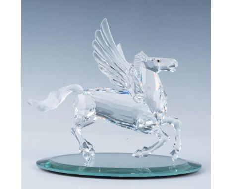 Faceted clear body, outstretched wings, and frosted tail, captured in a dynamic rearing pose. 1998 Swarovski SCS member. This
