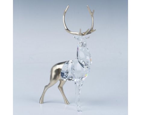 This elegant stag features a modern twist on a festive motif, with faceted crystals on the front and a brushed champagne gold