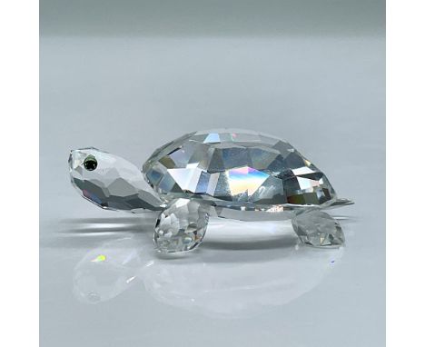 Features a glimmering crystal tortoise with blue green eyes. This item has its original box measuring 3.25"L x 3.25"W x 2.5"H