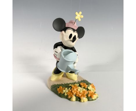 This figurine depicts Minnie from the story Mickey Cuts Up. This item has its original box. Box measures 8.5"L x 8"W x 6.75"H
