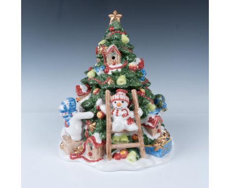 A charming hand-painted figural cookie jar featuring cheerful snowmen decorating a large Christmas tree adorned with bluebird