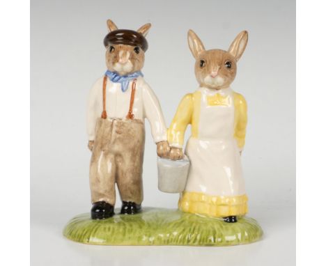 A couple holding a bucket together, wearing antique clothing. Yellow, white, and brown coloration. Part of the Nursery Rhyme 