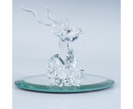 A graceful kudu with frosted antlers and warm amber eyes rests peacefully, exuding a sense of tranquility. Includes oval mirr