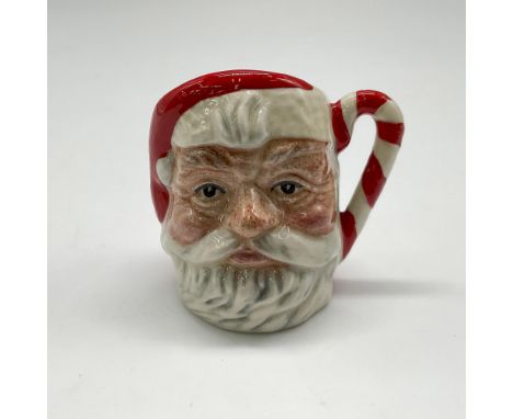 Commissioned by Seaway China Marine City in a special edition of 2,500. Red and white figural jug of Kris Kringle. Red and wh