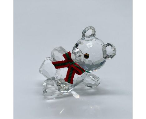 Cute teddy bear with a bow around its neck. This item has its original box measuring 3.25"L x 3.25"W x 2.5"H. Certificate of 