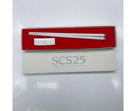 Celebrating the 25th anniversary of the SCS and Chinese Year of the Dragon. A set of white chopsticks featuring small and lar