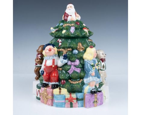 Festive hand painted ceramic cookie jar. Santa sits atop the Christmas tree surrounded by presents and toys. Spode backstamp.