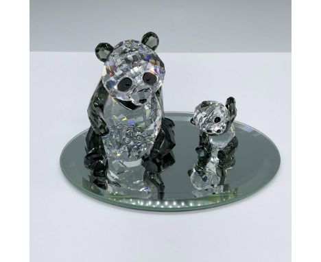 Crafted from clear and black crystals, a Panda Mother with her cub. Includes an oval mirror base. Swarovski swan marks. Panda