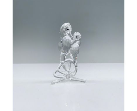 Lead crystal piece modeled of a couple of seahorses swimming in the calm ocean waters. Swarovski swan mark. This item has its