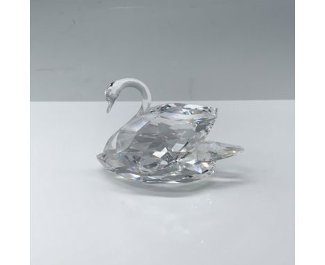 Excellent figure of a crystal swan with its wings tucked behind them. Swarovski backstamp. This item has its original box 4.5