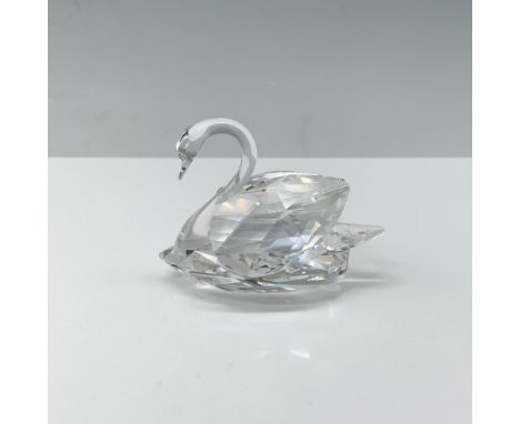 Stunning figure of a crystal swan with its wings tucked behind them. Swarovski backstamp. This item has its original box 3.75