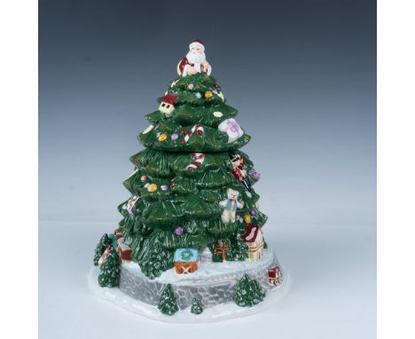 A delightful hand-painted figural cookie jar showcasing Santa beside a festive Christmas tree, beautifully decorated with gif