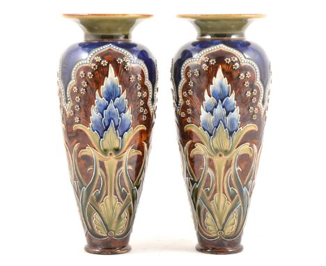 A pair of Doulton Lambeth vases by Eliza Simmance and Bessie Newberry, with three green and light blue floral panels, 22.5cm.