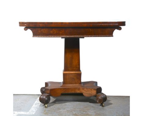 A Victorian mahogany card table, rectangular fold-over top with broad cross-banding, rounded corners, enclosing a baize-lined